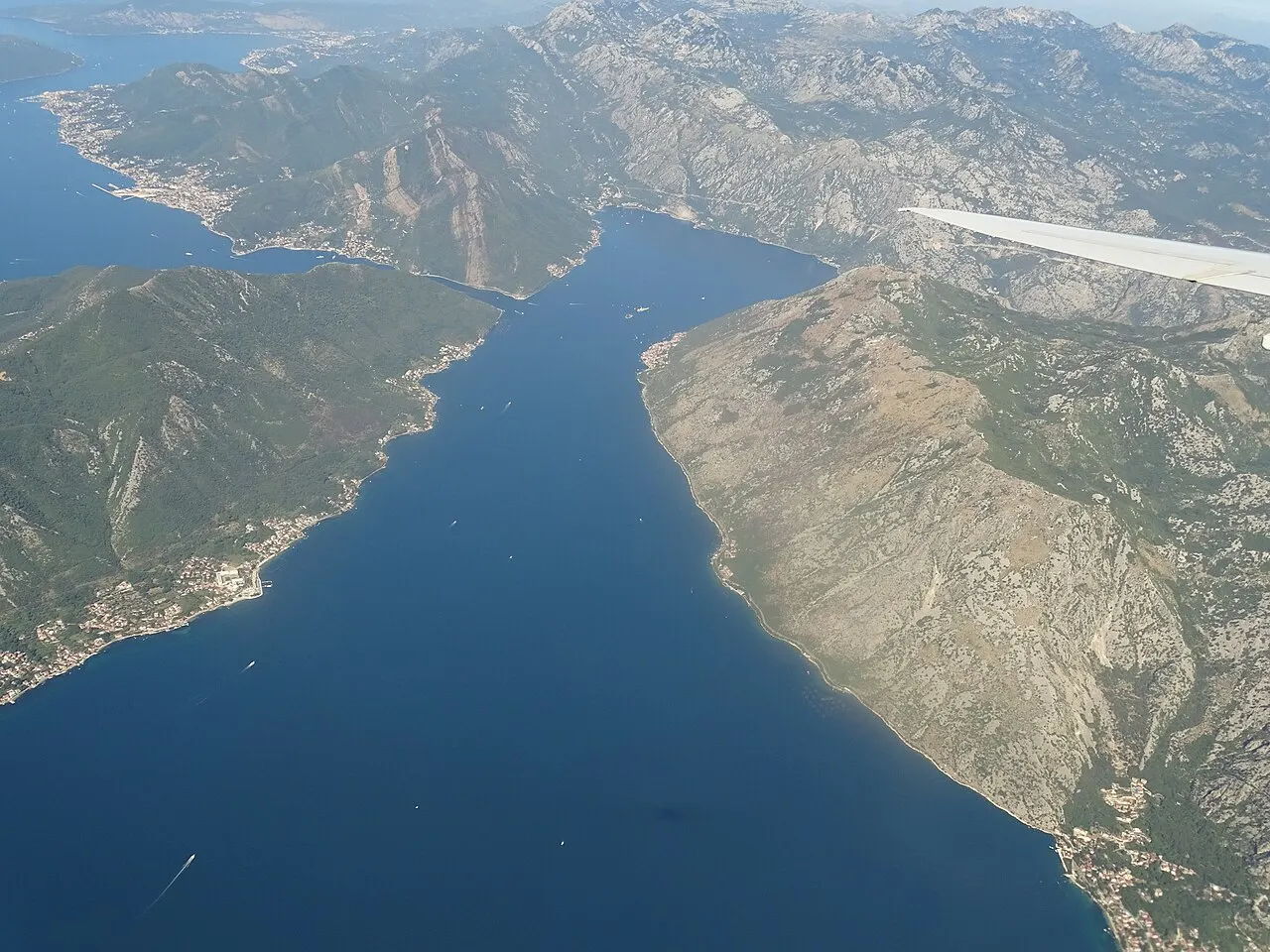 Aerial view over the Bay of Kotor, Montenegro, the shoreline and mountains around the inner bay