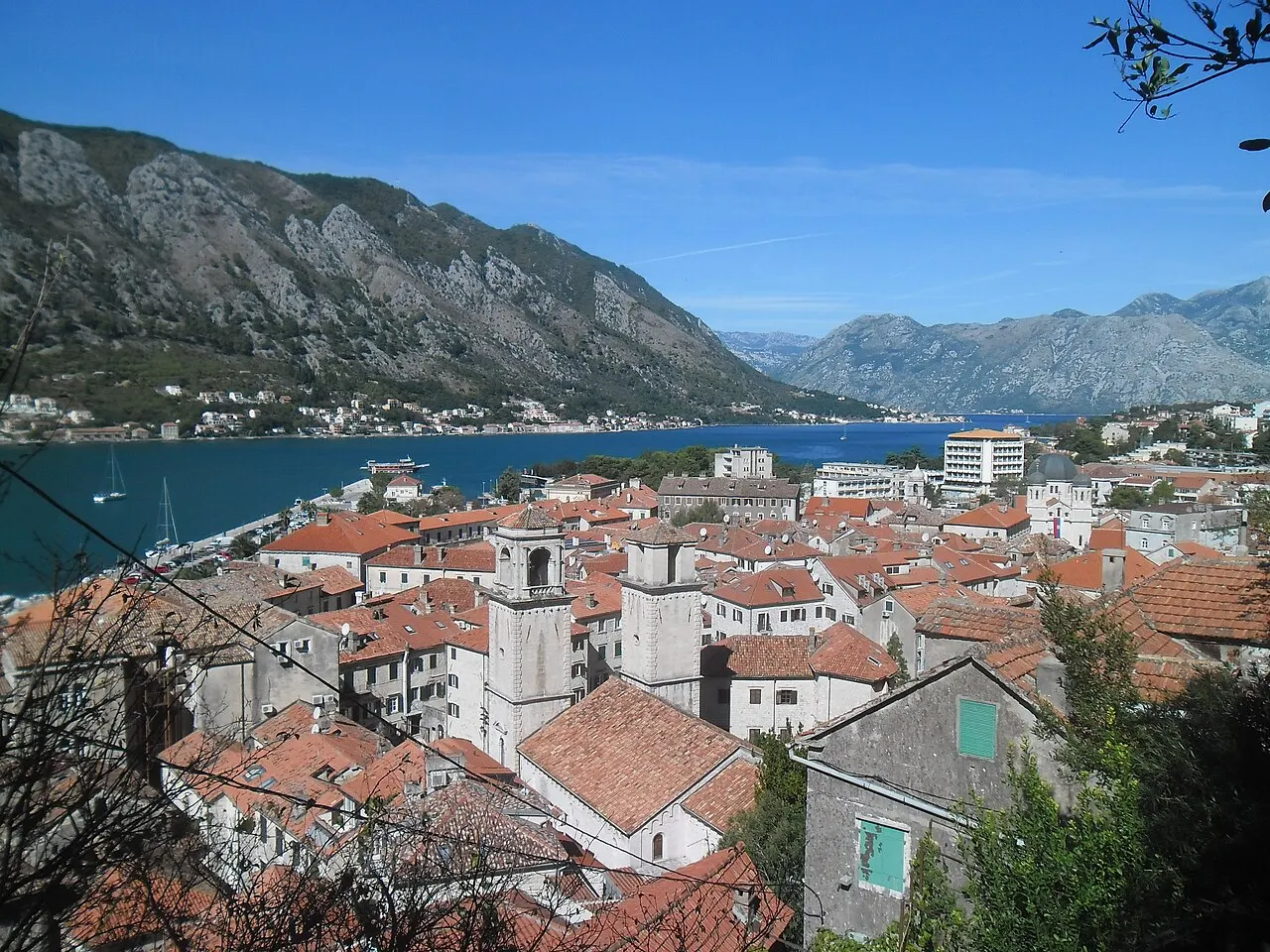 Kotor's walled Old Town rooftops and the bay seen from partway up the city walls