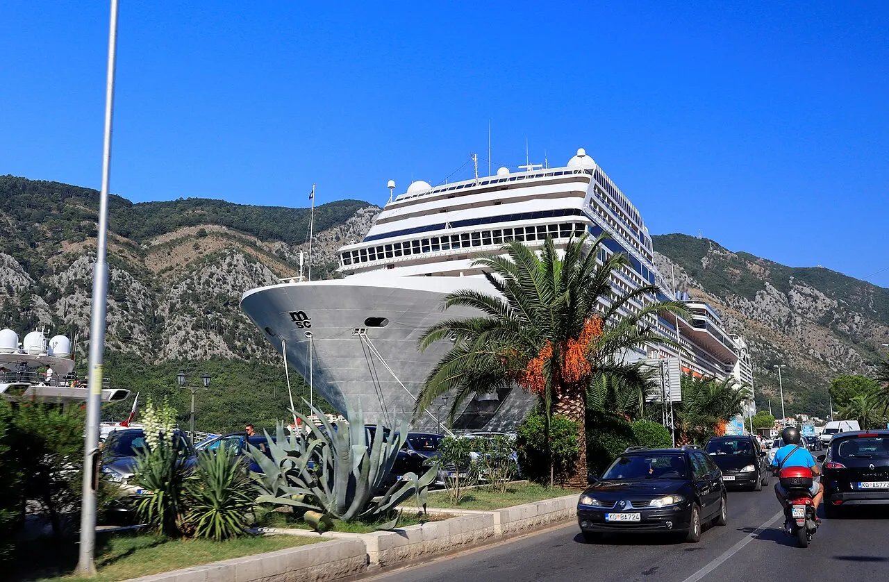 The cruise ship MSC Magnifica at the Kotor berth below the bay's mountains