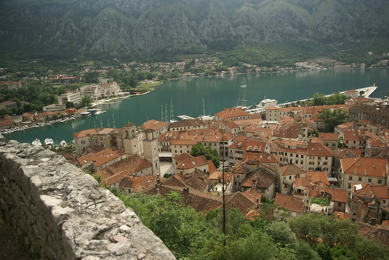 Kotor Old Town red-tiled rooftops and the foot of the city walls seen from above