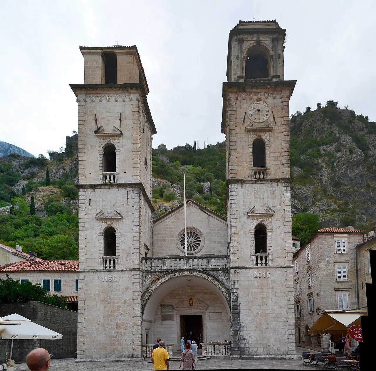 St Tryphon Cathedral and its square in Kotor's Old Town, the twin Romanesque bell towers in daylight