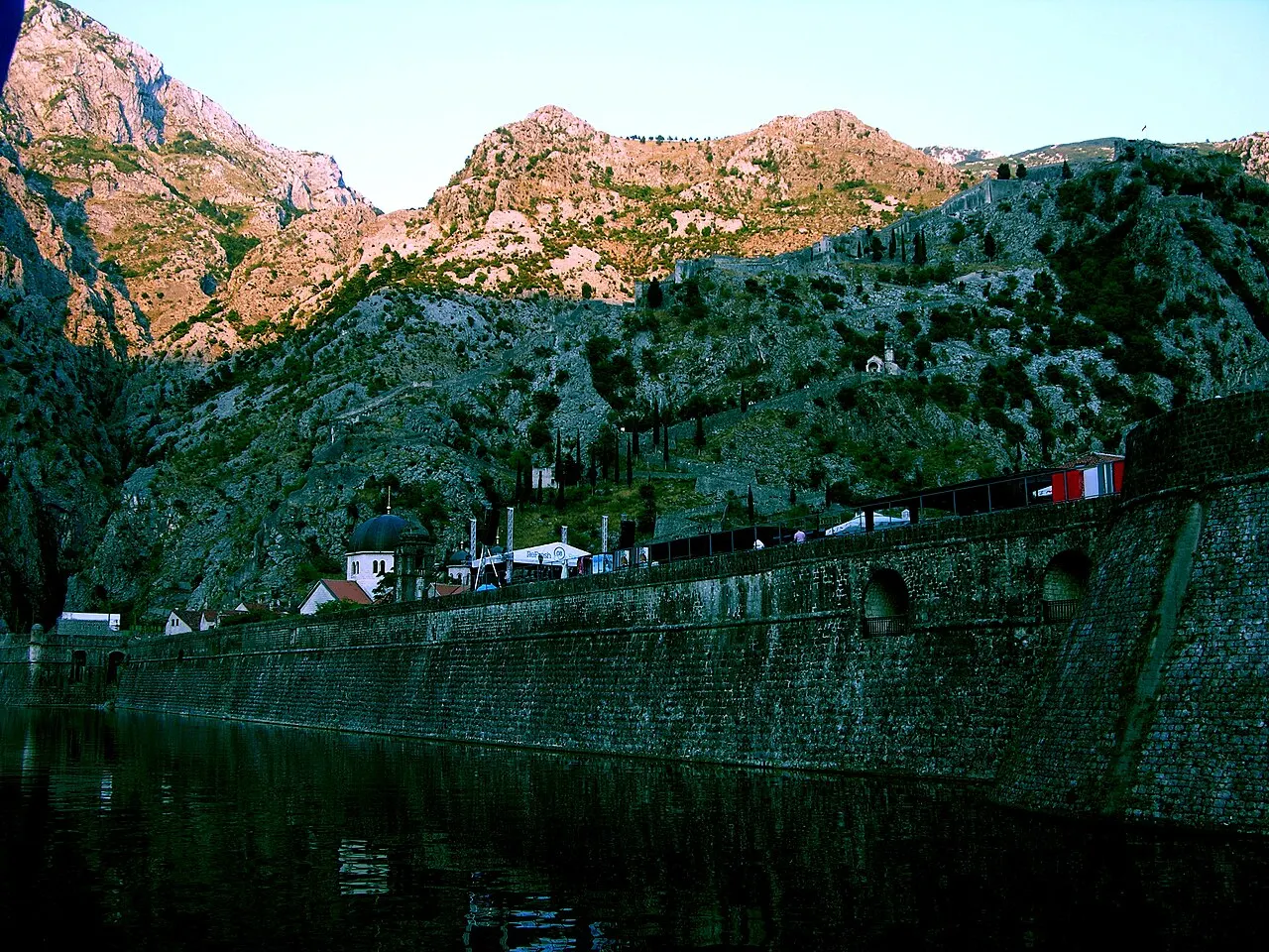 Kotor's fortified ramparts climbing the cliff above the Old Town's terracotta roofs