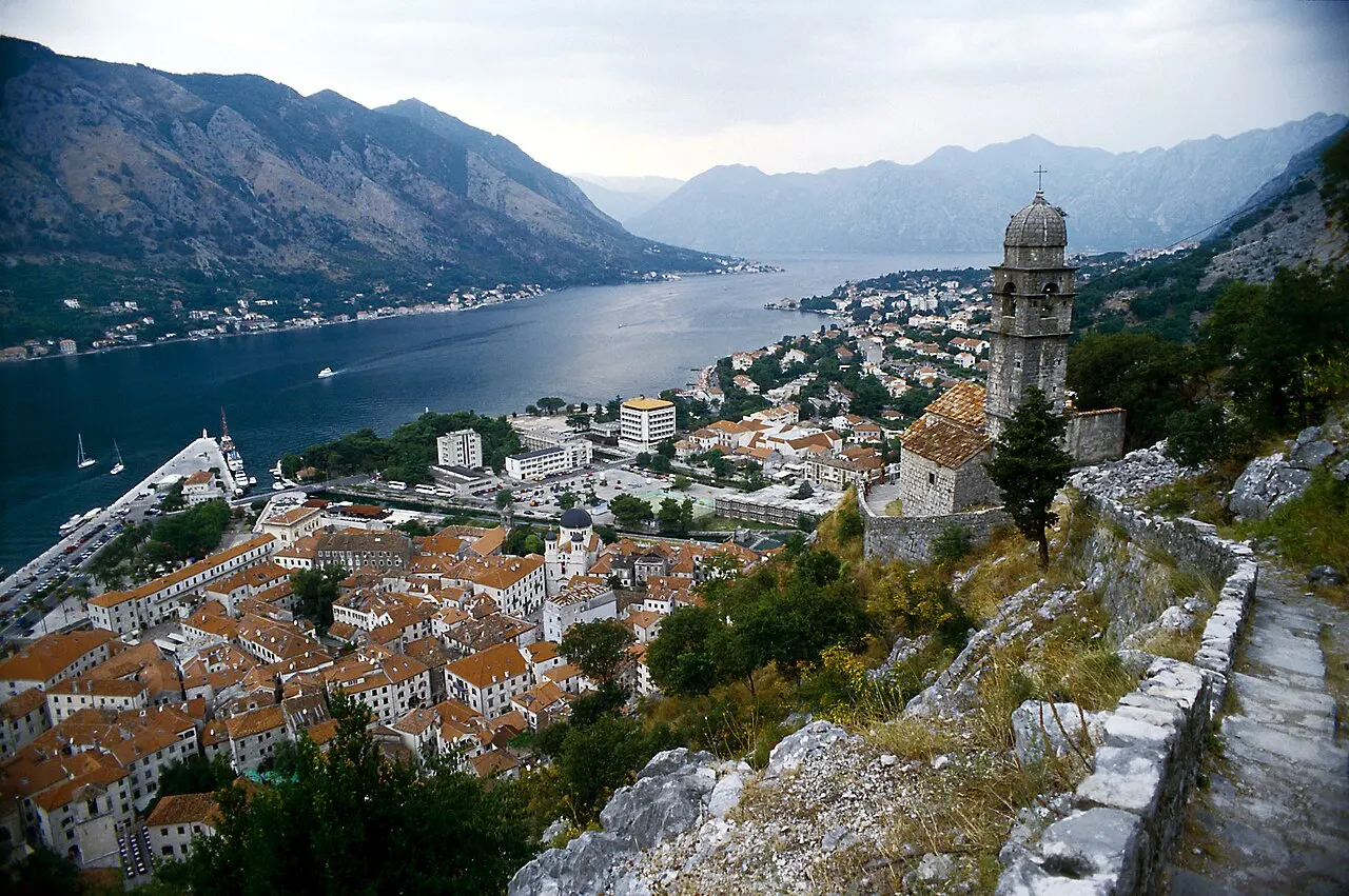 Church of Our Lady of Remedy on the slope above Kotor's roofs, with the bay beyond