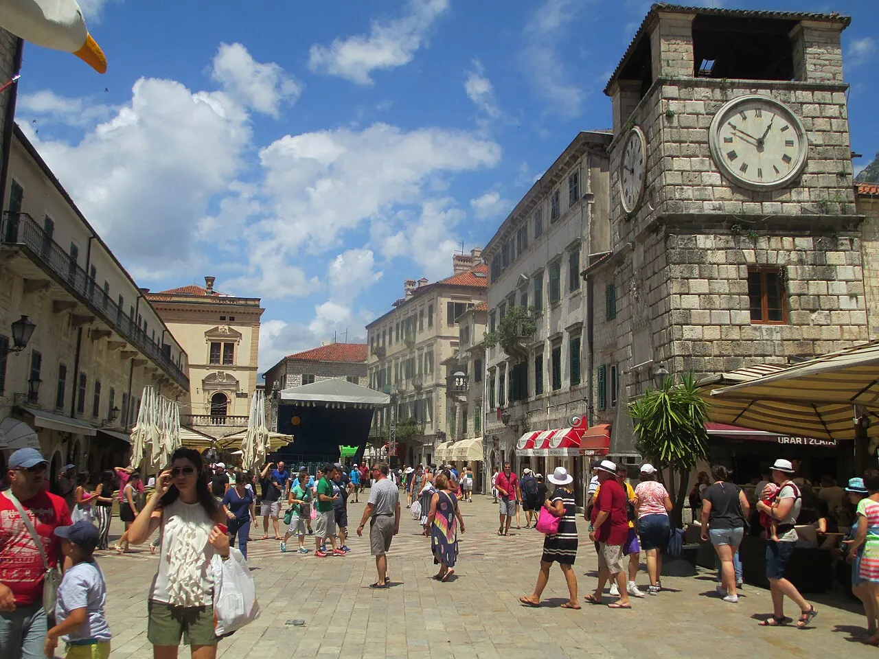 Palazzo facades and stone arches around the Arms Square in Kotor's Old Town, Montenegro