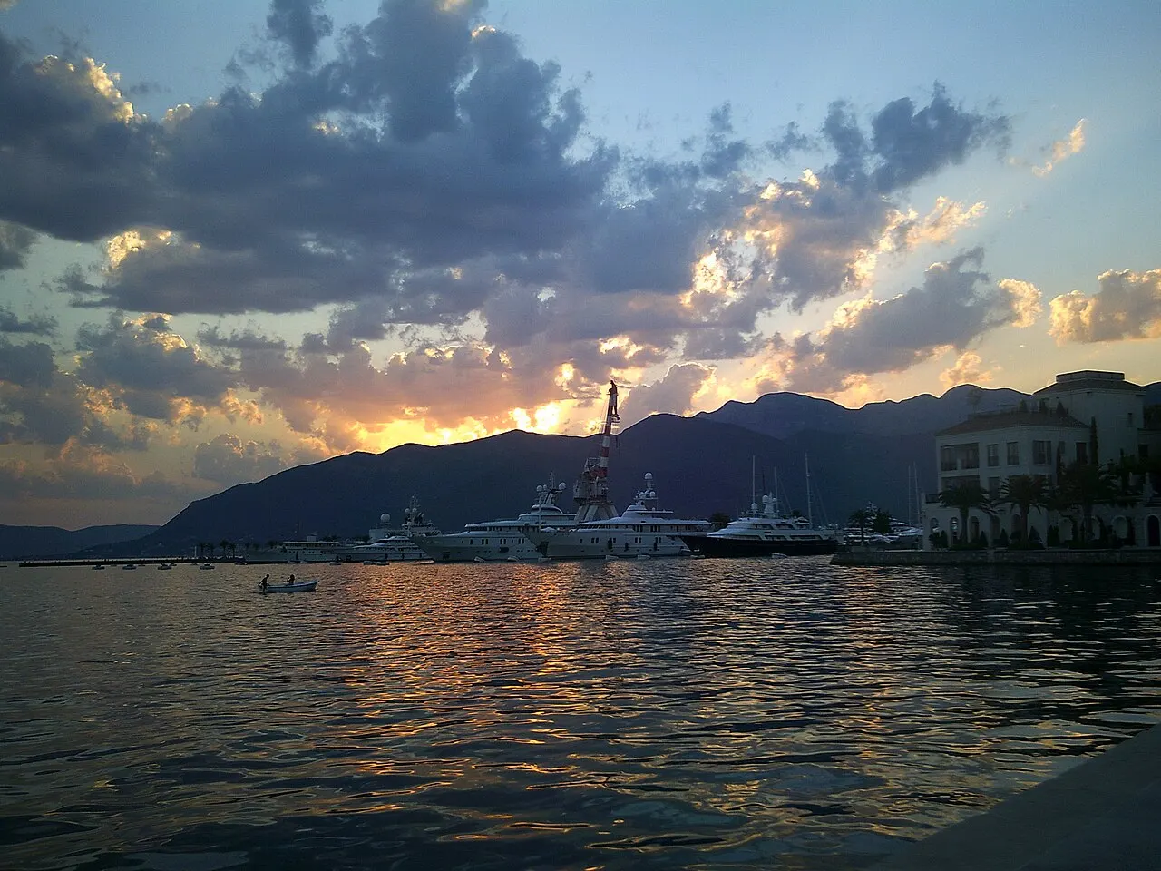 Superyachts moored at Porto Montenegro marina in Tivat at sunset