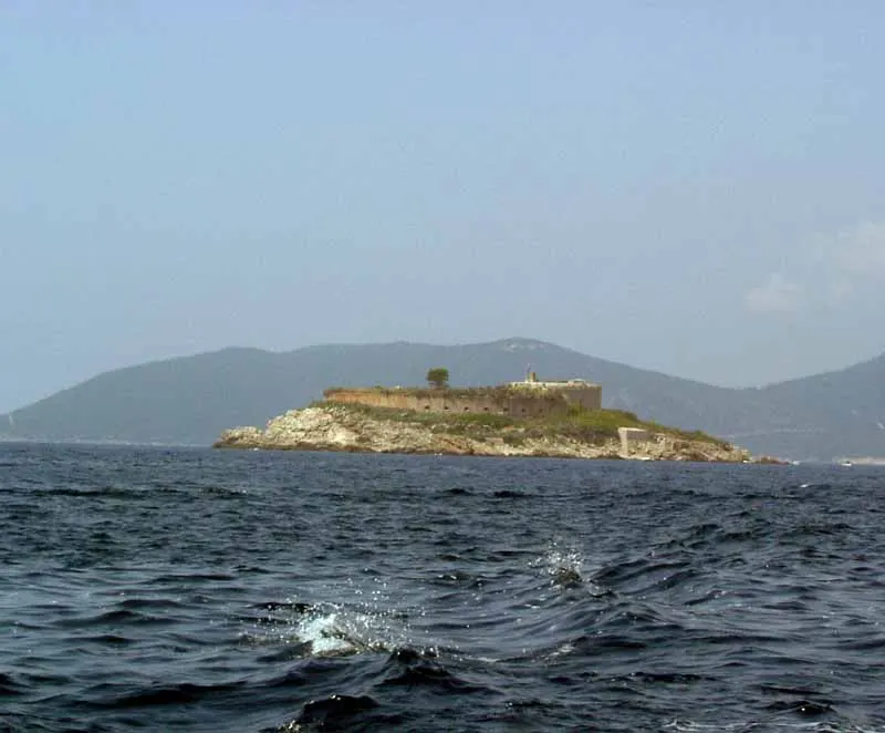 The round Mamula fortress filling its small island, seen across the sea