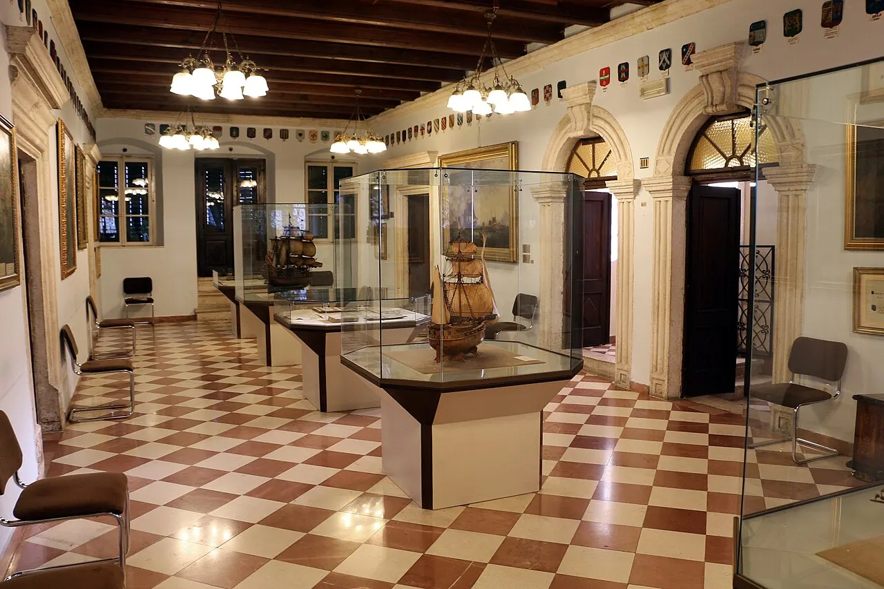 Model sailing ships in glass cases and portraits in the Maritime Museum gallery