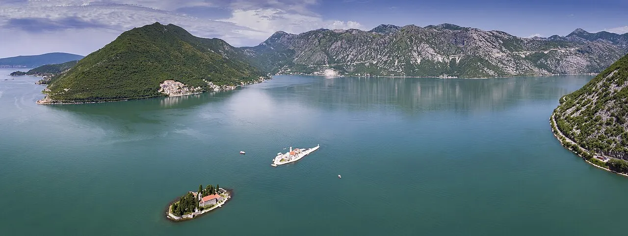 Perast and the islands of Our Lady of the Rocks and Sveti Đorđe on the calm Bay of Kotor