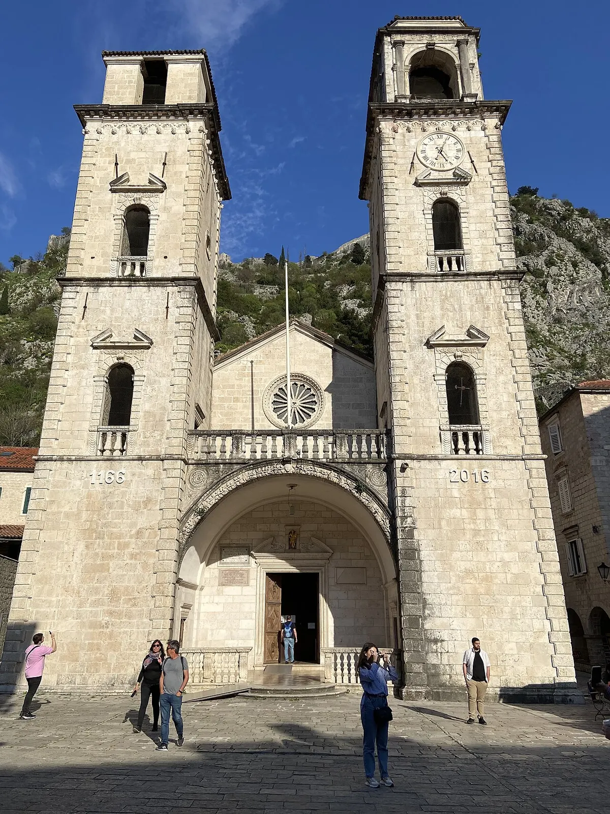 The twin Romanesque towers of St Tryphon Cathedral above its square in Kotor