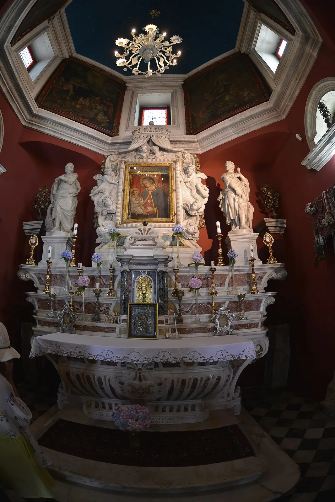 Interior of Our Lady of the Rocks, the icon set above the marble altar beneath the painted dome
