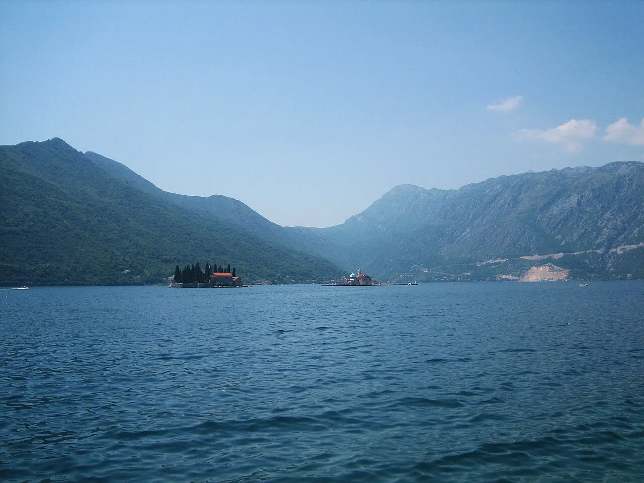 The two islets off Perast: cypress-dark St George beside the domed Our Lady of the Rocks