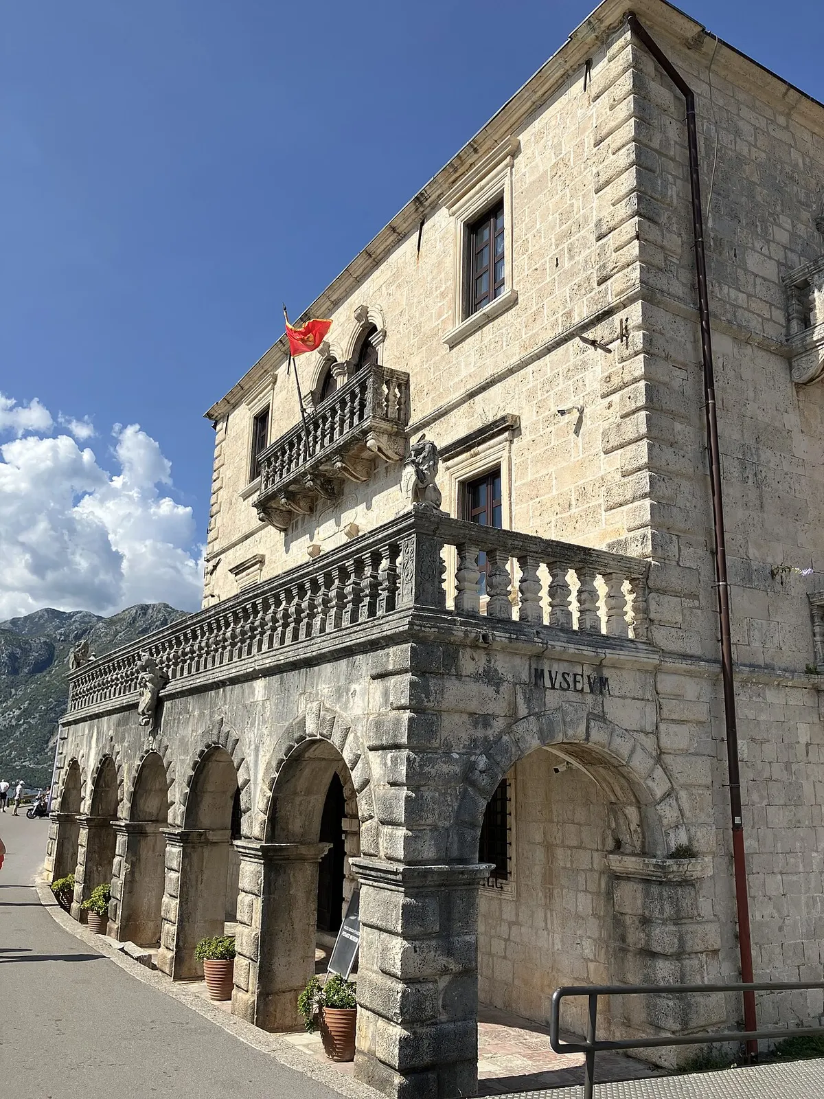 The arcaded stone Bujovic palace in Perast, a restored baroque palazzo above the bay