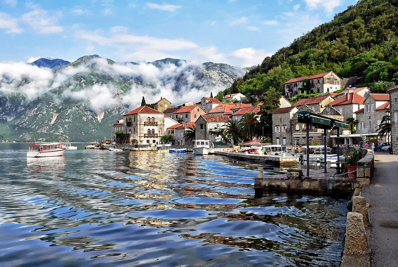 Morning clouds over Perast and its quay on the Bay of Kotor before the day boats arrive