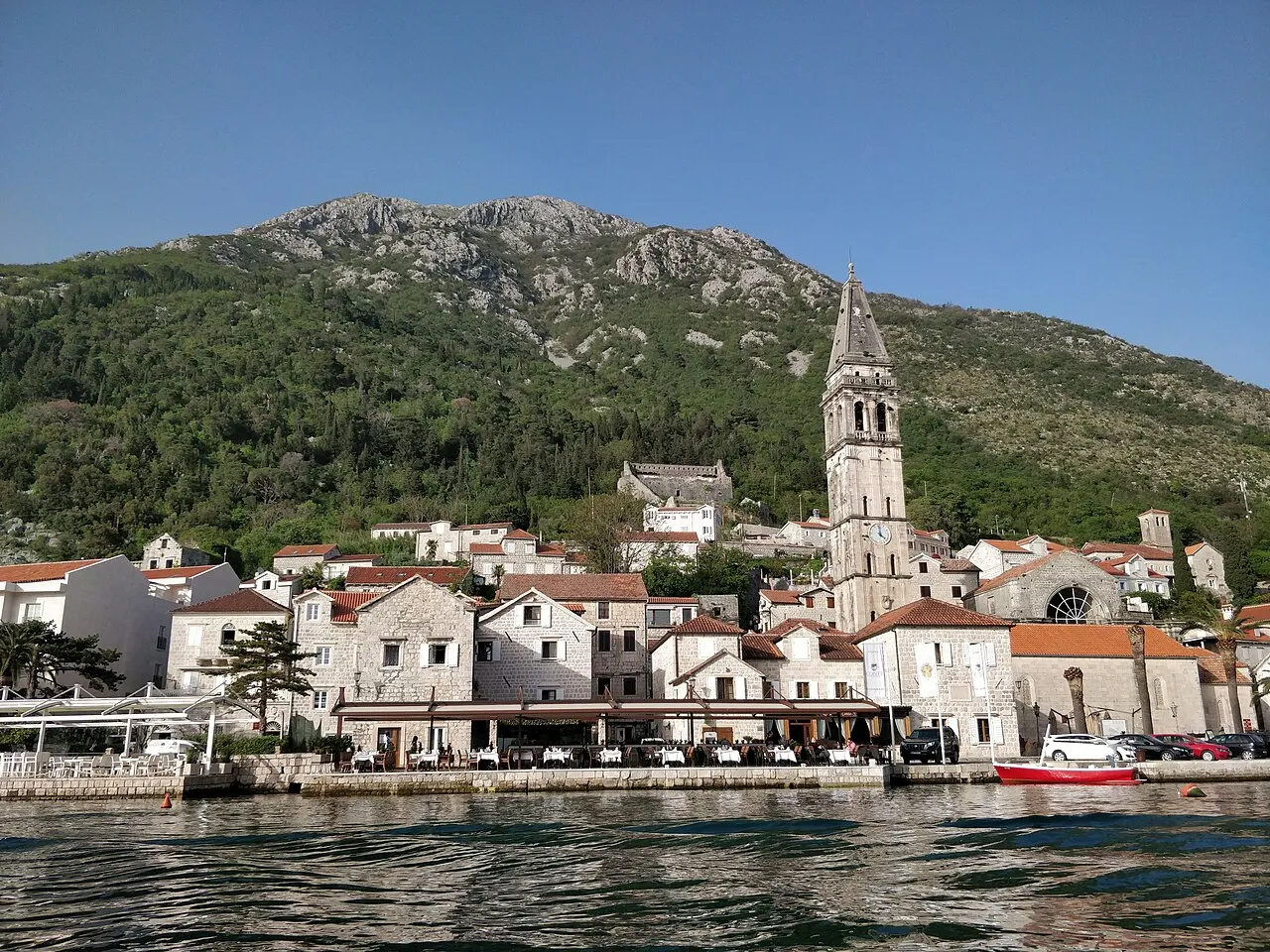 Perast and the bay seen from a boat on a still morning