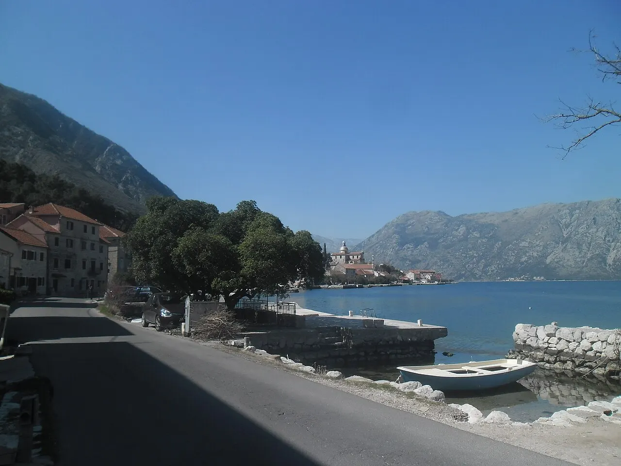 The view across the still Bay of Kotor from Prčanj, mountains rising behind