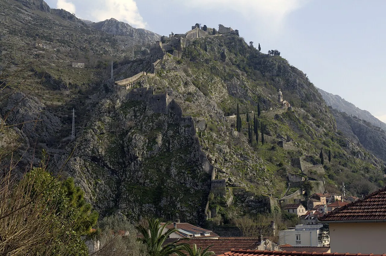 The ruined bastions of St John Fortress on the ridge above Kotor with the Bay of Kotor opening below